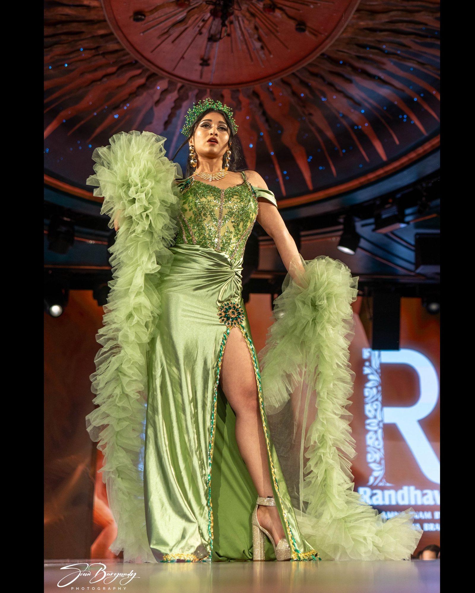Sage green gown with tulle boa, NYFW