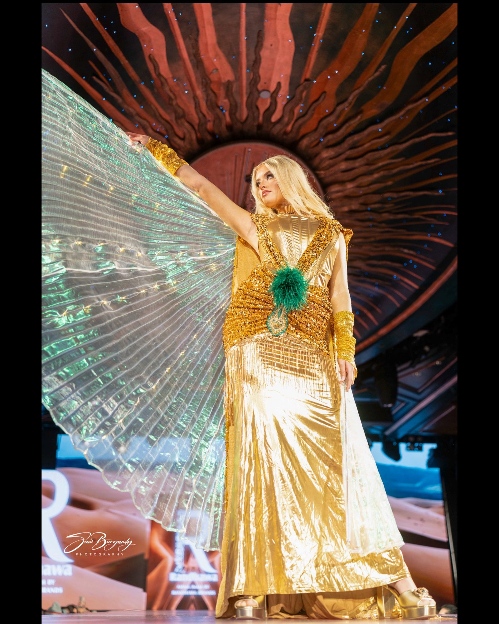 Gold gown with iridescent wing cape, NYFW